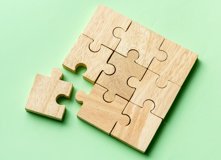 Wooden puzzle with a piece missing